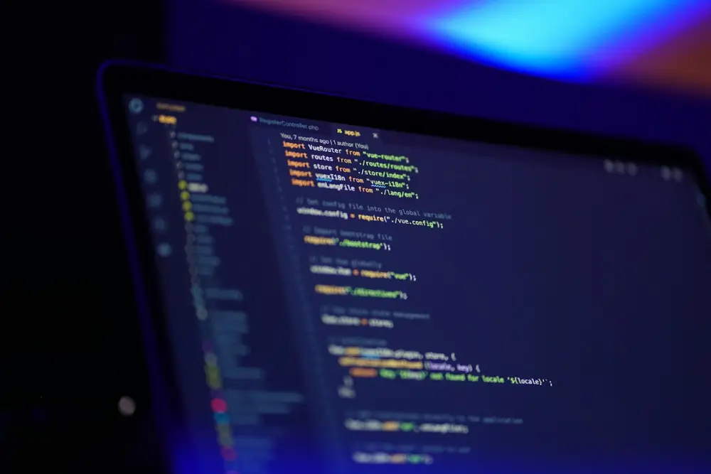 Developer writing code on a laptop