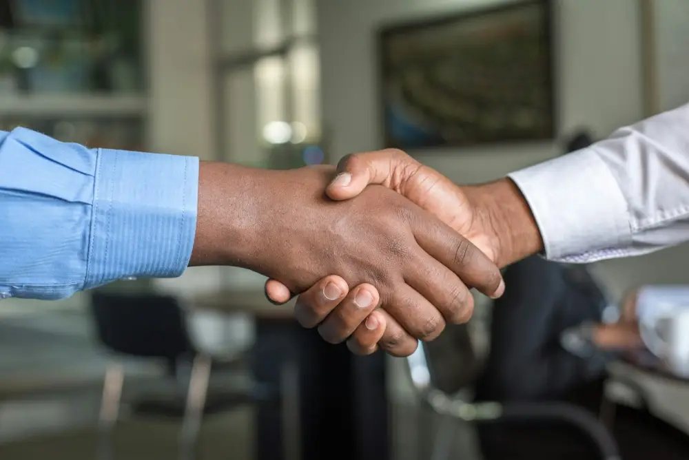 Handshake after a private sector job offer