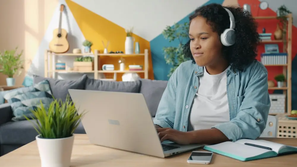 Happy student enjoying an online lesson at home