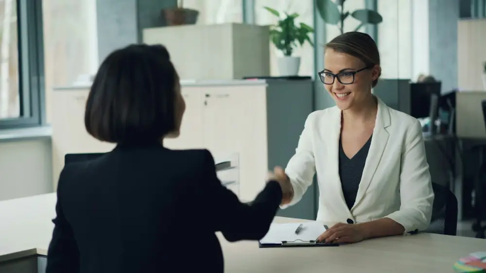 HR interviewer meeting a job candidate