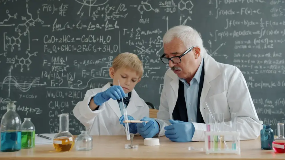 Student and teacher conducting a chemistry experiment