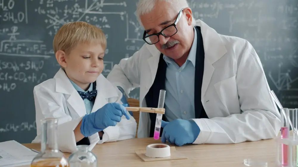 Student and teacher watching a chemical reaction