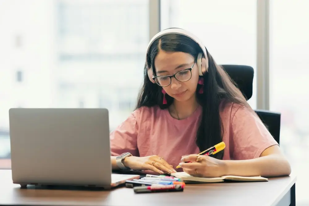 Student with headphones learning in a one-to-one online tutoring session