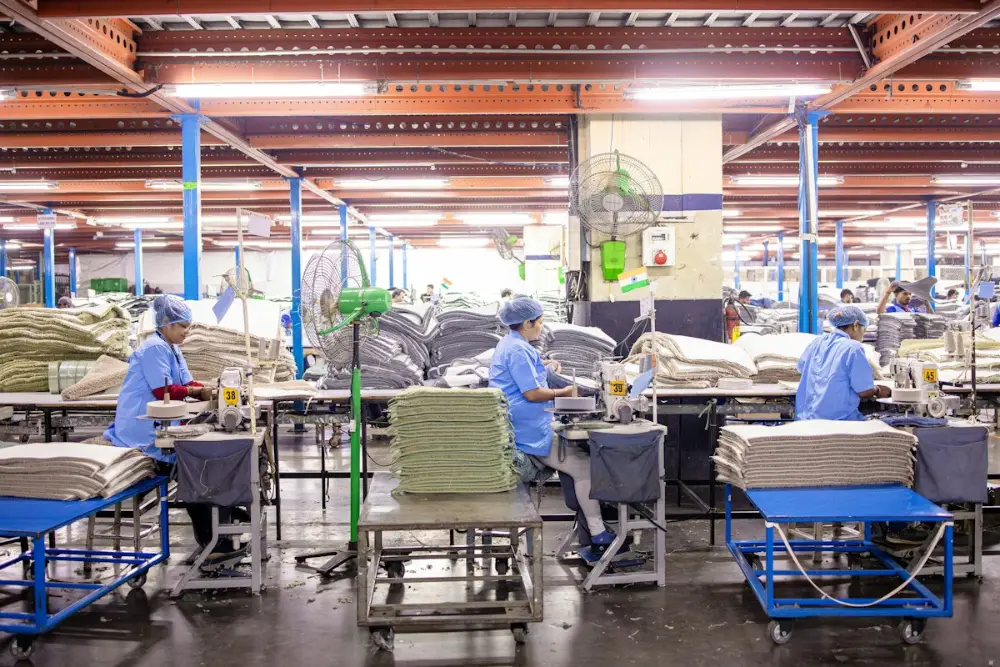 Workers in an industrial textile manufacturing facility
